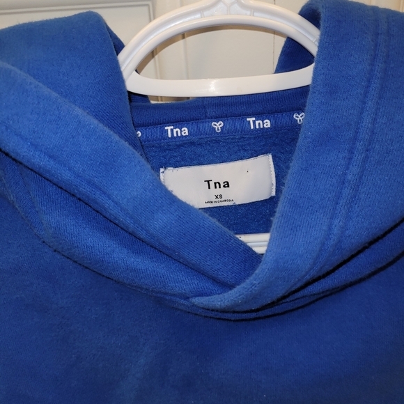 TNA Tops - 3/25❤ TNA cropped royal blue hoodie. XS.